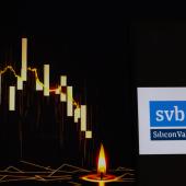 Silicon Valley Bank logo with a declining stock chart in the background. 