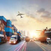 International trade represented by an airplane, cargo ship, trucks, and freight containers