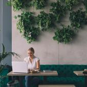 Woman working in trendy coffee shop