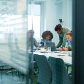 Office workers deliberating