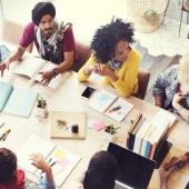 a diverse group of business people around a table