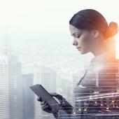 a business woman holding a tablet