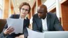 Two business people discussing
