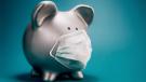 Piggy bank with medical mask